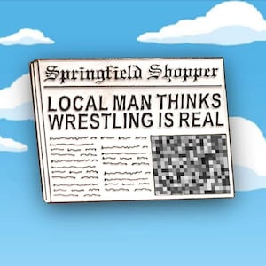Emaille pin Wrestling Is Real krant