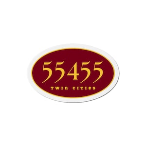 May include: An oval sticker with a maroon background and gold trim. The number "55455" is in gold, with "twin cities" in small, gold letters below.