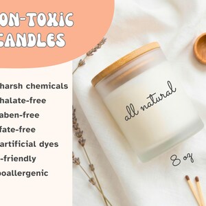 May include: A frosted glass candle with a wooden lid, labeled "all natural" and containing 8 oz. The image also includes a wooden spoon, matches, and a dried orange slice. The text reads "Non-Toxic Candles."