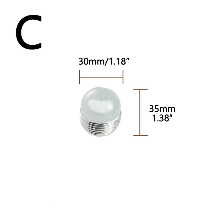 K&ouml;nnte beinhalten: Ein klares, kugelf&ouml;rmiges Objekt mit einem silbernen Drahtfu&szlig;. Das Objekt ist 35 mm hoch und 30 mm breit. Der Buchstabe "C" befindet sich in der oberen linken Ecke.