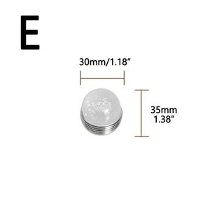 K&ouml;nnte beinhalten: Ein klarer, kugelf&ouml;rmiger Gegenstand mit silberner Basis, mit einem Durchmesser von 30 mm und einer H&ouml;he von 35 mm. Das Objekt hat ein strukturiertes Inneres. Der Buchstabe "E" befindet sich in der oberen linken Ecke.