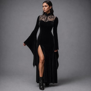 May include: A floor-length black velvet dress featuring long flared sleeves, a high neckline, and a sheer lace panel across the upper chest. The garment includes a fitted bodice and a high side slit that extends from the thigh to the hemline.