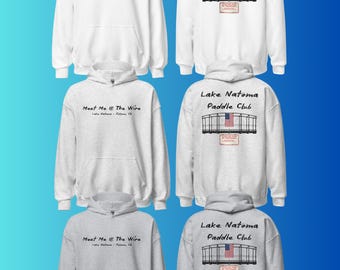 May include: A collection of white and grey hooded sweatshirts featuring the text Meet Me @ The Wire Lake Natoma - Folsom, CA on the front and Lake Natoma Paddle Club with a graphic of a bridge and an American flag on the back.