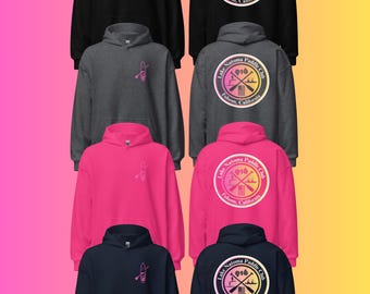 May include: Four hooded sweatshirts in black, dark gray, pink, and navy blue. Each features a small pink paddleboard graphic on the front left chest and a large circular Lake Natoma Paddle Club Folsom, California logo with a gradient on the back.