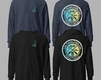 May include: Four long-sleeved hooded shirts in navy blue and black. The front of the shirts feature a teal paddleboard graphic. The back of the shirts display a circular logo with the text "Lake Natoma Paddle Club 916 Folsom, California."