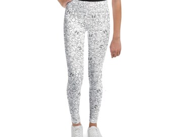 May include: White leggings with a black and white ghost pattern. The leggings feature a repeating design of various ghost illustrations, bones, and spiderwebs. The leggings are made of a soft, stretchy material.