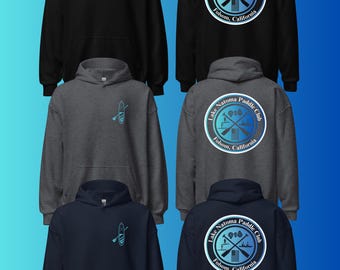 May include: A collection of six hooded sweatshirts in black, dark gray, and navy blue. Each features a small paddleboard graphic on the front left chest and a large circular Lake Natoma Paddle Club Folsom, California logo on the back.