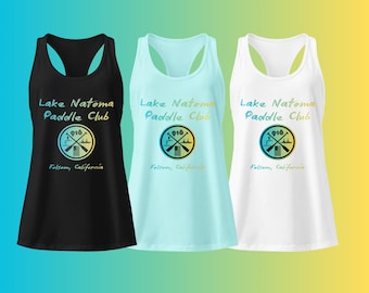 May include: Three tank tops in black, light blue, and white, each featuring the text "Lake Natoma Paddle Club" and a circular graphic with paddles and the number "916". The text "Folsom, California" is also included.