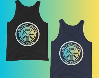 May include: Two tank tops, one black and one navy blue, each featuring a circular logo for the Lake Natoma Paddle Club. The logo includes the text "916" and "Folsom, California" with crossed paddles.