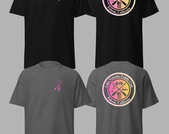 May include: Black and charcoal gray t-shirts. Each shirt features a pink paddleboard graphic on the front. The back of each shirt displays a circular logo with the text "Lake Natoma Paddle Club 916 Folsom, California."
