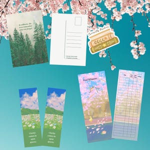 May include: A collection of stationery items, including a postcard with a forest scene and text, two bookmarks with landscape art, and a reading tracker. A sticker with the text "Currently Reading" and a bookmark with a floral design are also visible.