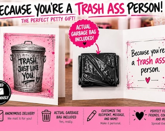 May include: A white greeting card featuring a metallic trash can illustration with the text "TRASH. JUST LIKE YOU." on the front. The inside contains a black plastic garbage bag and the text "Because you're a trash ass person." with a pink heart.