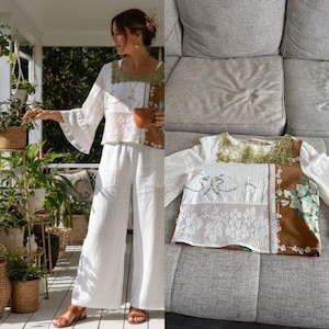May include: White linen wide-leg pants and a matching top with bell sleeves. The top features a patchwork design with lace, embroidery, and a brown floral print. The neckline and sleeves are trimmed with green crochet.
