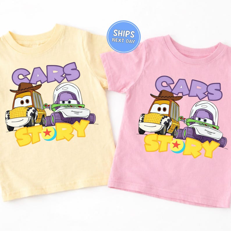 two children's t-shirts with a cartoon design of two cars, one yellow and one pink, along with the text "Cars Story" printed on them.