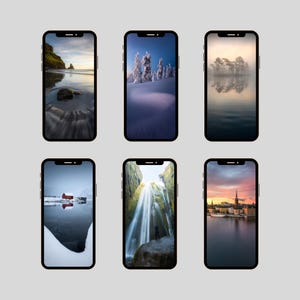 May include: Six smartphones displaying scenic landscape wallpapers. The screens showcase diverse natural scenes, including a beach, snowy mountains, a foggy lake, a red cabin by the water, a waterfall, and a city skyline at sunset.