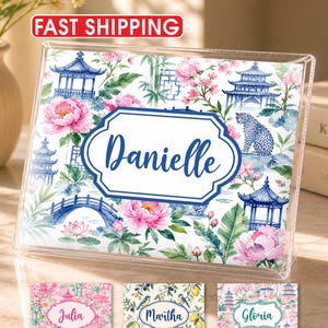 May include: A clear acrylic photo frame with a floral and pagoda design. The frame features the name "Danielle" in a blue, decorative font. Additional name tags with floral designs are also visible. The words "Fast Shipping" are in a red oval.