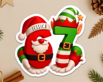 May include: A festive sticker featuring the number 6 and 7 in a Christmas theme. The number 6 is red with a Santa Claus design and the name "JESSICA". The number 7 is green with an elf hat. Both numbers have black belts and are holding hands.