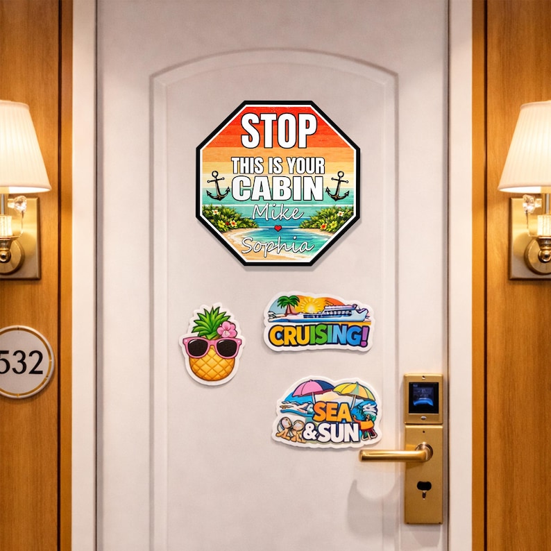 May include: A white door with decorative magnets. The largest magnet is a stop sign that says "STOP THIS IS YOUR CABIN" with a beach scene and names. Other magnets include a pineapple, a cruise ship, and "SEA & SUN".