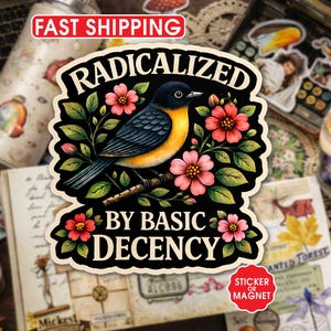 May include: A sticker or magnet featuring a bird illustration with the text "RADICALIZED BY BASIC DECENCY." The bird has blue, yellow, and black feathers, surrounded by pink flowers and green leaves. The sticker is on a background of a journal and other decorative items.