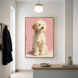 May include: A rectangular wall art print featuring an oil painting of a fluffy cream-colored dog sitting against a solid light pink background. The artwork is enclosed in a thin gold frame, showcasing visible brushstrokes and textured paint application.