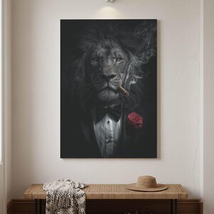 May include: A wall art print featuring a lion dressed in a black tuxedo with a white shirt, a black bow tie, and a red rose on the lapel. The lion is smoking a cigar, with wisps of smoke rising against a dark, moody, monochromatic background.