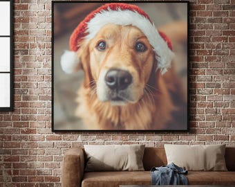 May include: A square wall art print featuring a golden retriever dog wearing a red and white Santa hat. The dog has brown eyes, a black nose, and long golden fur. The print is framed in a thin black border and displayed on a brick wall.
