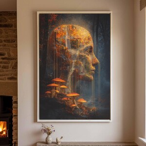 May include: A rectangular framed wall art print featuring a surreal profile of a human head composed of autumn foliage and a cascading waterfall. The base of the image displays a cluster of orange mushrooms set against a dark, misty forest background.