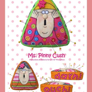 May include: A triangular fabric pincushion featuring a cartoon face with hands covering eyes, decorated with colourful circles and a pink flower button. The text reads Ms. Pinny Cush, Instructions & Patterns for a 14 cm Pincushion, darn!, and ouch!.