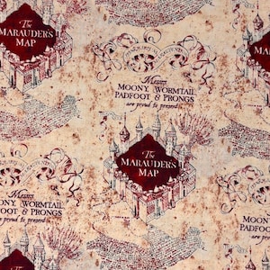 May include: A beige fabric featuring a repeating print of The Marauder's Map. The design includes dark red castle illustrations, intricate scrollwork, and text reading Messrs. Moony, Wormtail, Padfoot & Prongs are proud to present.