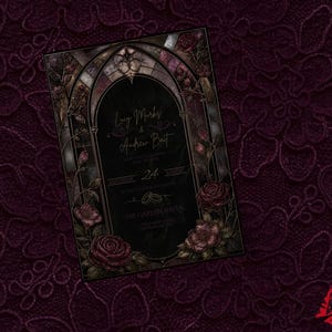 May include: A gothic wedding invitation with a stained-glass arch design, featuring the names "Lucy Marks & Andrew Britt" in gold script. The invitation is decorated with roses and set against a deep burgundy lace background.