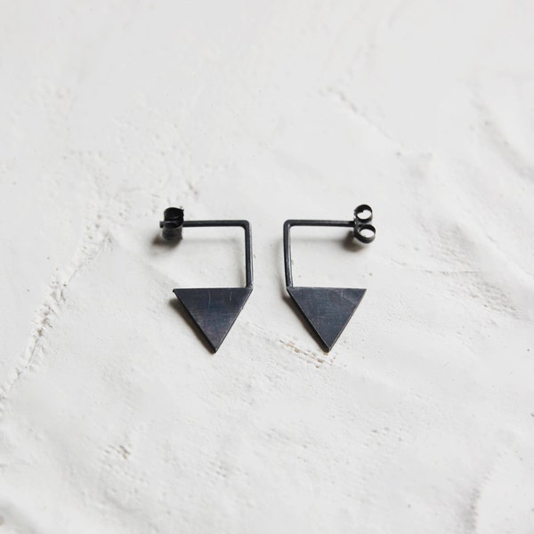 Geometric silver earrings. Triangle