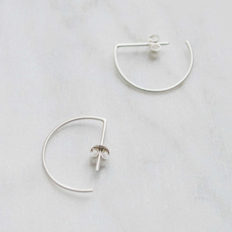 Dainty half circle earrings in silver Brushed matte
