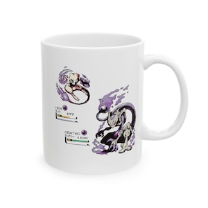 May include: White ceramic mug featuring two Pokémon illustrations, Mew and Mewtwo, with Japanese text and HP stats. The designs are in shades of purple and white, with a clean, minimalist aesthetic.