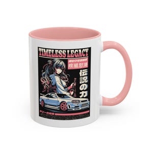 May include: White ceramic mug with a pink interior and handle. The mug features a graphic of an anime-style woman with a car, and Japanese text. The text "TIMLESS LEGACY" is at the top of the graphic.