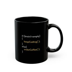May include: Black ceramic coffee mug with white and gold text. The text reads: "if (brain!=empty) { keepCoding(); } else { orderCoffee(); }". The mug has a curved handle and a glossy finish.
