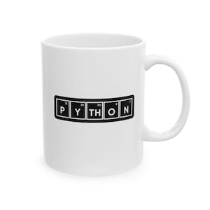 May include: White ceramic mug with a black and white design. The design spells out "PYTHON" using a periodic table-style layout. The mug has a curved handle and a glossy finish.