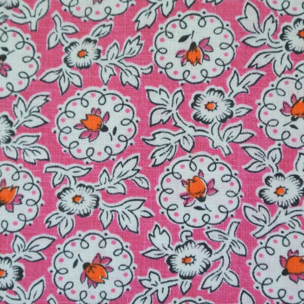 Vintage 1940s printed quilt fabric in highquality unused cotton with small orange/pink/black flower pattern on pink bottomcolor