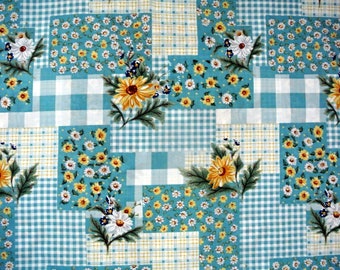 May include: A blue and white checkered fabric with a patchwork design featuring white daisies and yellow flowers. The fabric has a vintage feel and would be perfect for quilting, crafting, or home decor projects.