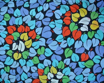 May include: A fabric with a repeating pattern of stylized leaves in various colors. The leaves are in shades of blue, green, yellow, and red, set against a dark background. The design is reminiscent of a botanical print.