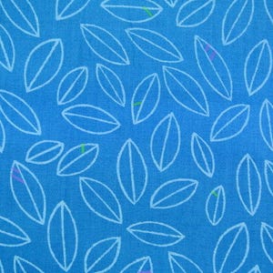 May include: A blue fabric with a white leaf pattern. The leaves are all the same size and shape, and they are arranged in a repeating pattern.