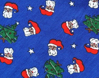 Vintage 1980s Christmas fabric in highquality unused cotton with small printed christmas-tree/ Santa Claus face motive on blue bottomcolor