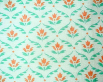 Vintage 1970s quilt fabric in unused cotton/ synthetic with printed light orange/light green flower checkered pattern on creame white bottom