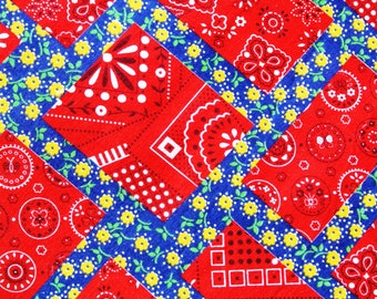 Vintage 1980s quilt fabric in unused cotton with red/ yellow/ white crazy quilt pattern on darkblue bottomcolor