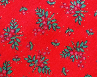 Vintage 1970s quilt fabric in unused cotton/ synthetic with pink/ green larger printed berries motive on deep red bottomcolor