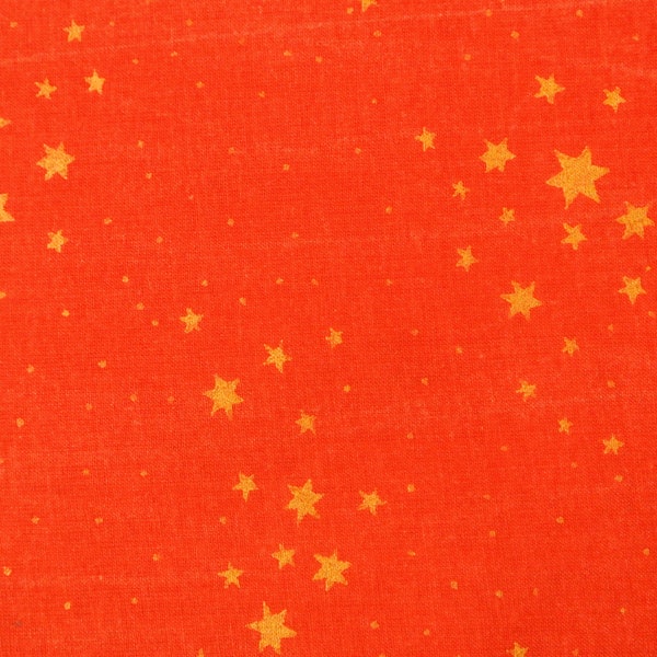 Vintage 1980s Christmas fabric in prewashed cotton with small goldcolor printed star pattern motive on cler red bottomcolor