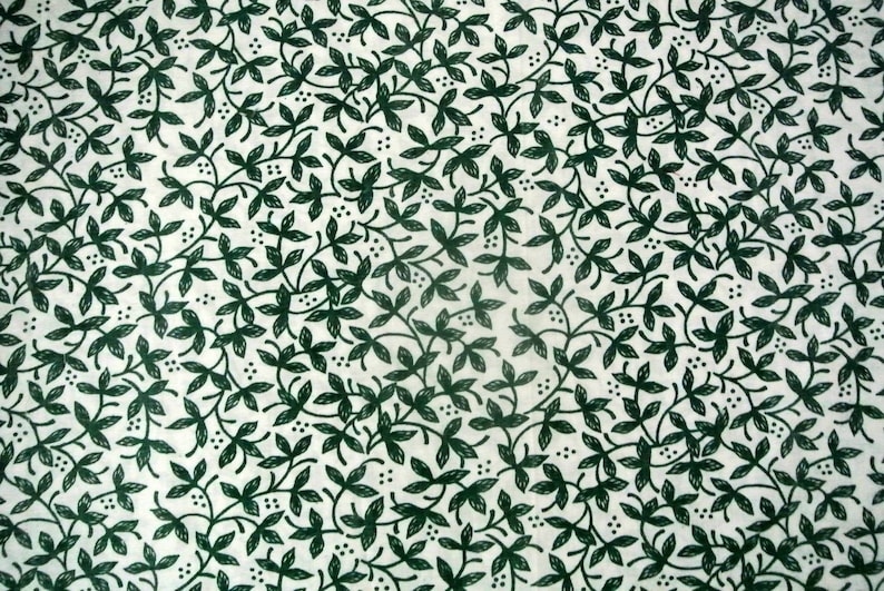 Vintage 1970s quilting sewing fabric in highquality unused cotton with small darkgreen leafe pattern on bone white bottomcolor