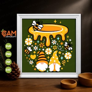 May include: A framed digital art print featuring a whimsical design with bees, honey, flowers, and gnomes. The artwork is set against a green background and includes the text "CAM Artcraft" and file type icons.