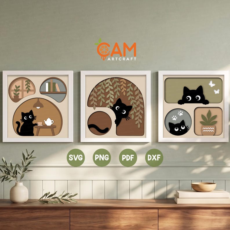 May include: Three square wall art prints featuring layered paper-cut style illustrations of black cats in various settings. The designs include a cat with tea, a cat behind hanging vines, and a cat with a potted plant, all in neutral earth tones.