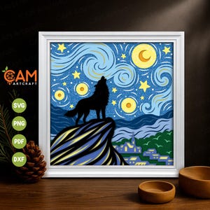 May include: A framed art print depicting a howling wolf silhouette against a starry night sky. The artwork features a vibrant blue background with yellow stars and a crescent moon. The print is in a white frame, with the CAM Artcraft logo visible.