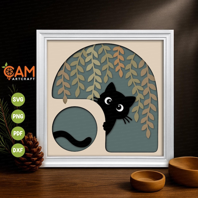May include: A layered paper art piece in a white frame featuring a black cat peeking from behind a beige structure under hanging willow branches against a muted blue background. The design includes cutouts for SVG, PNG, PDF, and DXF file formats.